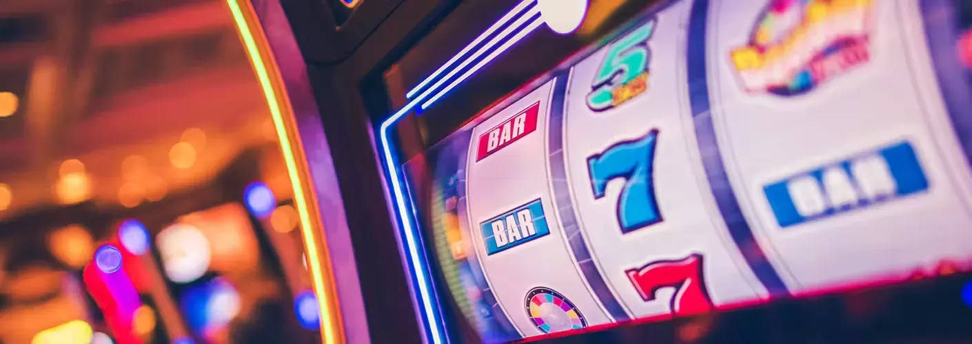 Bold black-and-gold slot reel showing triple sevens with golden coins pouring down